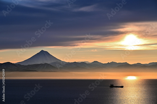 A beautiful harsh sunset against the backdrop of the Vilyuchinsky volcano in Kamchatka  photo