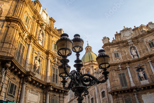 Cuattro Canti famous place in Palermo Italy with ancient historic street light lantern during sunset