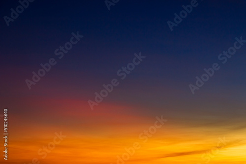 Sunset sky in the evening on twilight with colorful orange sunlight clouds  Dusk sky background 
