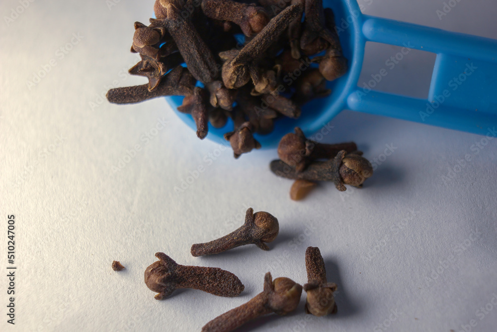 Extreme close up showing pile or collection of rose-apple or clove on white background, also known as laung