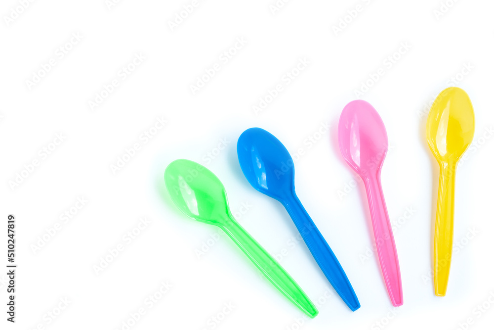Multicolor plastic spoons on white background Multicolor plastic spoons on white background