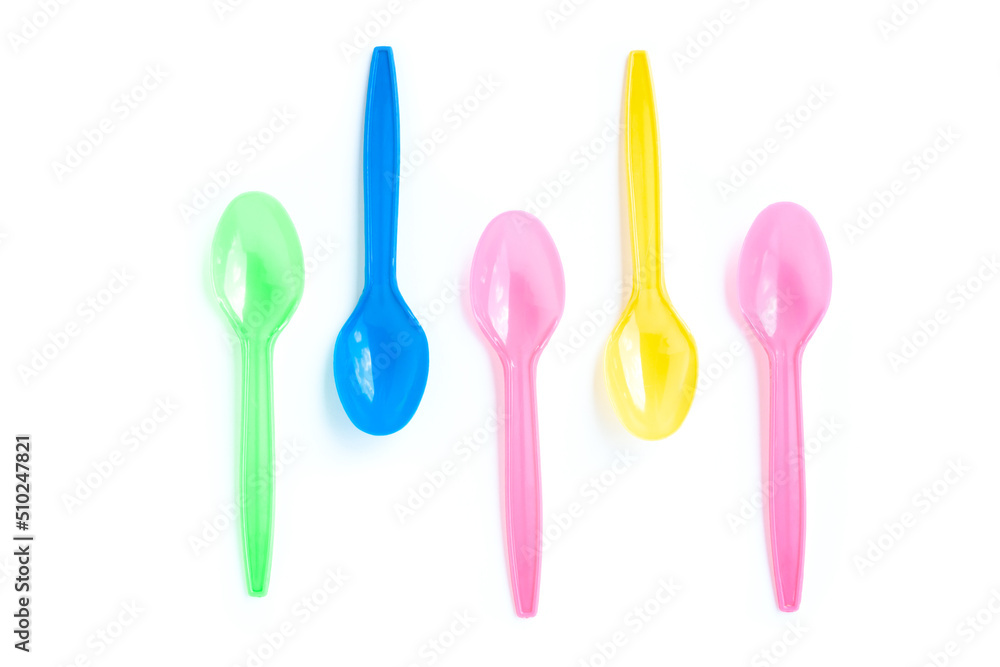 Multicolor plastic spoons on white background Multicolor plastic spoons on white background