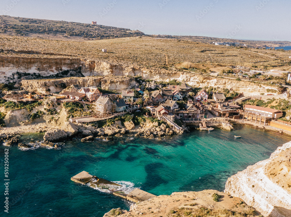 Aerial view of Popeye Village. Sunny day, blue sea, blue sky. Mellieha city. Malta Aerial view of Popeye Village. Sunny day, blue sea, blue sky. Mellieha city. Malta