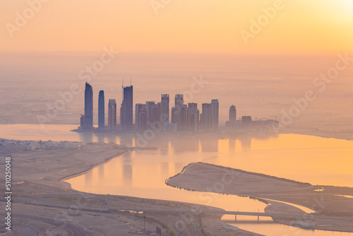 Canvas Print Skyline of towers by the Dubai Creek harbor by sunrise in winter