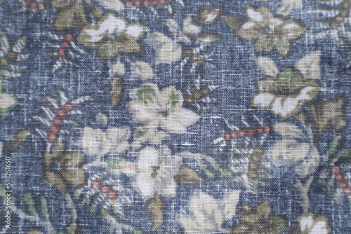 The blue and white floral fabric is a traditional Hawaiian pattern.