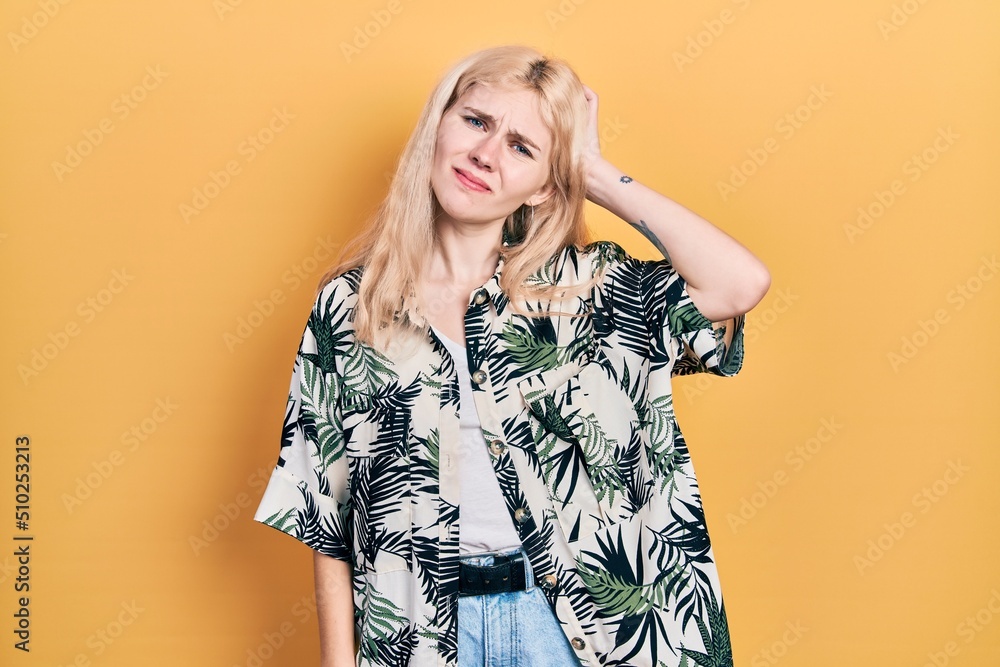 Beautiful caucasian woman with blond hair wearing tropical shirt confuse and wonder about question. uncertain with doubt, thinking with hand on head. pensive concept. Beautiful caucasian woman with blond hair wearing tropical shirt confuse and wonder about question. uncertain with doubt, thinking with hand on head. pensive concept.