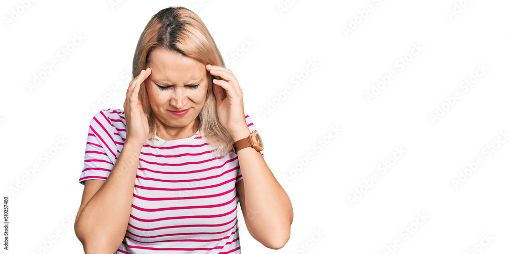 Young caucasian woman wearing casual clothes with hand on head, headache because stress. suffering migraine. Young caucasian woman wearing casual clothes with hand on head, headache because stress. suffering migraine.