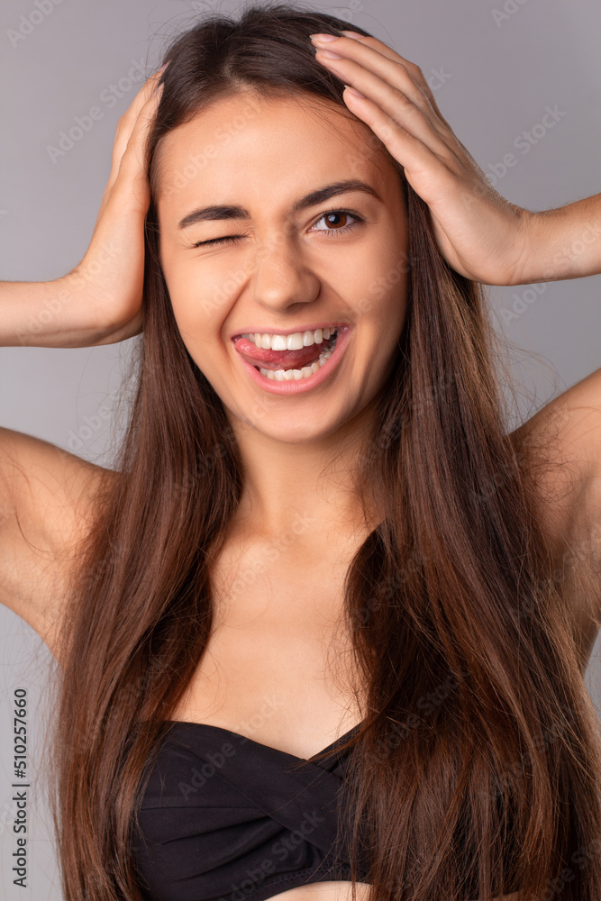 naughty hair brunette woman, smiling and shows the tongue
naughty hair brunette woman, smiling and shows the tongue