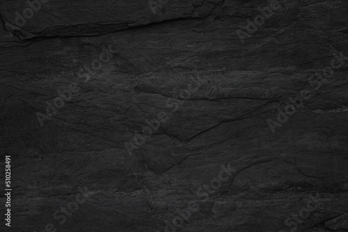 Dark grey black slate background or texture. Black granite slabs background.         