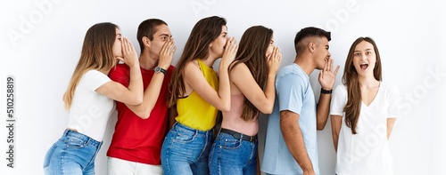 Fotografie Group of people wearing casual clothes standing over isolated background hand on