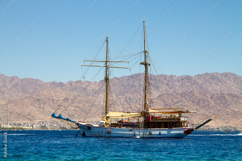 Eilat/ Israel - AUG 20 2020 : sailboat anchored in the Gulf of Eilat Eilat/ Israel - AUG 20 2020 : sailboat anchored in the Gulf of Eilat