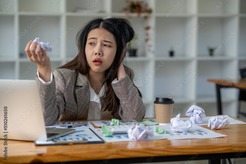 business woman crumpled the paper and tossed it The proposed project failed. have fatigue sleepy and bored from sitting at a desk for a long time and has office syndrome business woman crumpled the paper and tossed it The proposed project failed. have fatigue sleepy and bored from sitting at a desk for a long time and has office syndrome