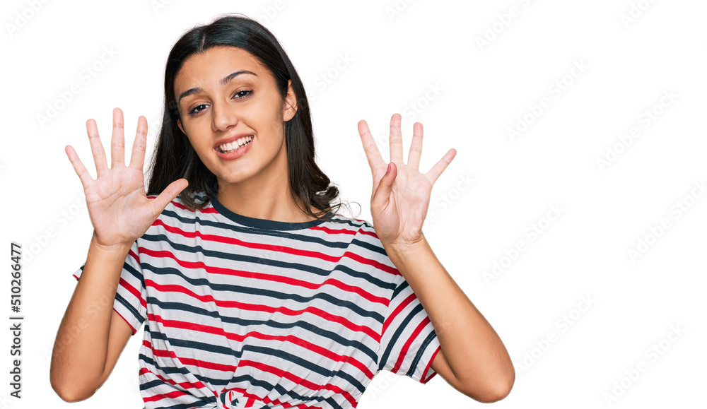 Young hispanic girl wearing casual clothes showing and pointing up with fingers number nine while smiling confident and happy. Young hispanic girl wearing casual clothes showing and pointing up with fingers number nine while smiling confident and happy.
