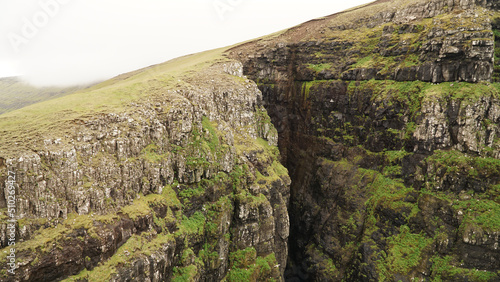 Ásmundarstakkur sea stack on Suðuroy Island in the Faroe Islands. photo