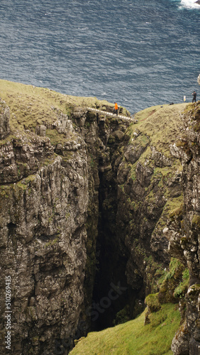 Ásmundarstakkur sea stack on Suðuroy Island in the Faroe Islands. photo