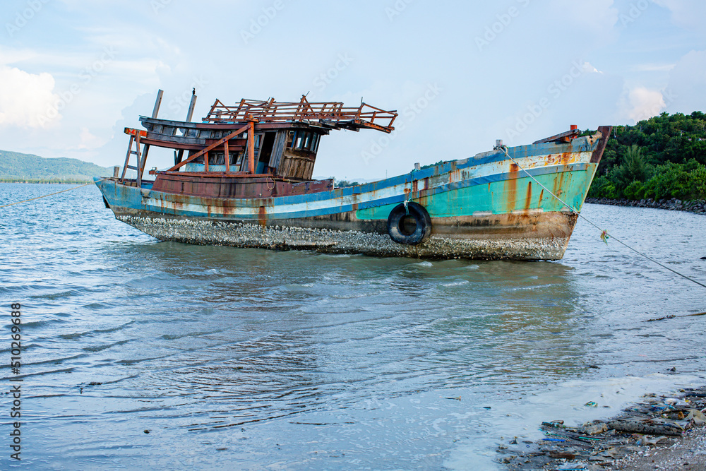 A fishing boat floating on the beach