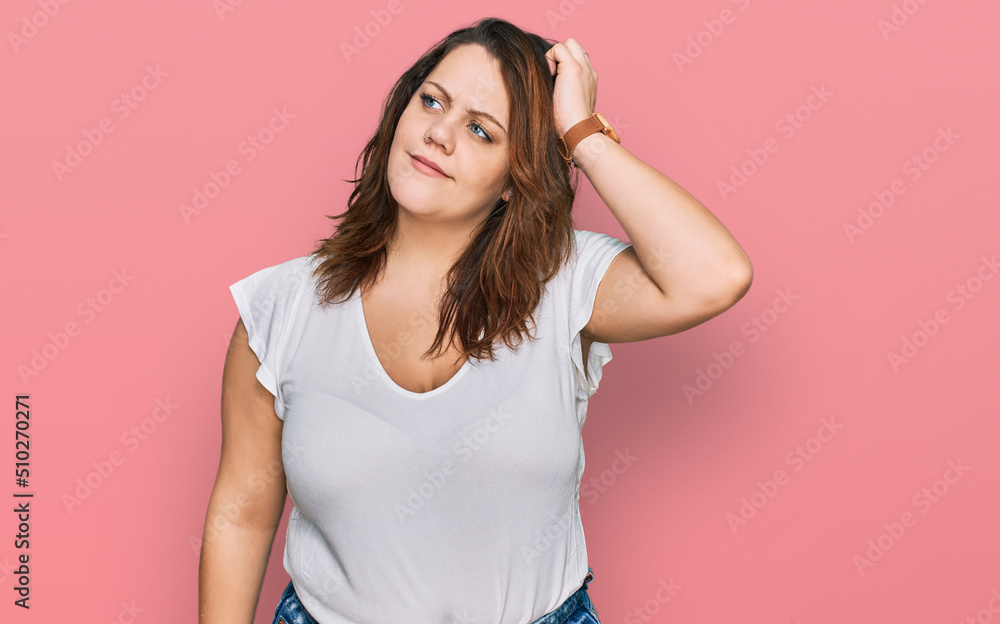 Young plus size woman wearing casual white t shirt confuse and wondering about question. uncertain with doubt, thinking with hand on head. pensive concept. Young plus size woman wearing casual white t shirt confuse and wondering about question. uncertain with doubt, thinking with hand on head. pensive concept.