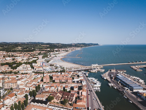 Italy  June 2022  aerial view of Fano with its sea  beaches  port  umbrellas in the marche region