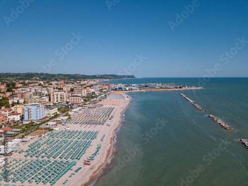 Italy, June 2022; aerial view of Fano with its sea, beaches, port, umbrellas in the marche region