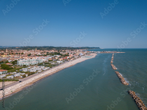 Italy, June 2022; aerial view of Fano with its sea, beaches, port, umbrellas