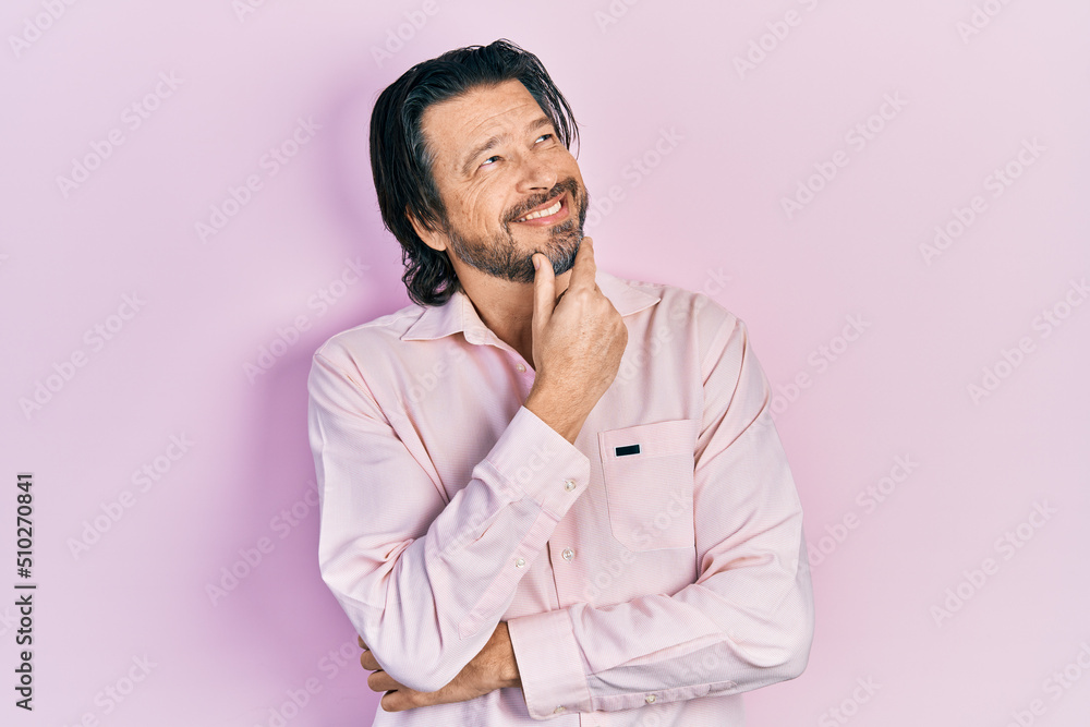 Middle age caucasian man wearing casual clothes looking confident at the camera with smile with crossed arms and hand raised on chin. thinking positive. Middle age caucasian man wearing casual clothes looking confident at the camera with smile with crossed arms and hand raised on chin. thinking positive.