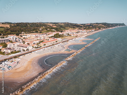 Italy, June 2022; aerial view of Fano with its sea, beaches, port, umbrellas