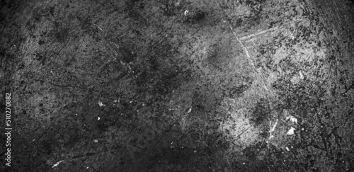 Grunge black texture. The texture of the scratches on the metal. Texture scratches background monochrome. Rough textured hard background. The surface is damaged.