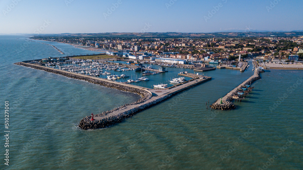 Italy, June 2022; aerial view of Fano with its sea, beaches, port, umbrellas