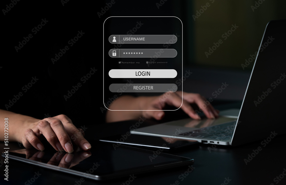 A businesswoman with a laptop computer is protected. The idea is to hack a Phishing mobile phone with a password in order to get access to security dangers and fraud online. A businesswoman with a laptop computer is protected. The idea is to hack a Phishing mobile phone with a password in order to get access to security dangers and fraud online.