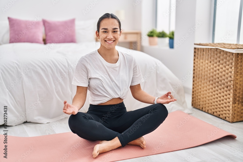 Young hispanic woman smiling confident training yoga at bedroom Young hispanic woman smiling confident training yoga at bedroom