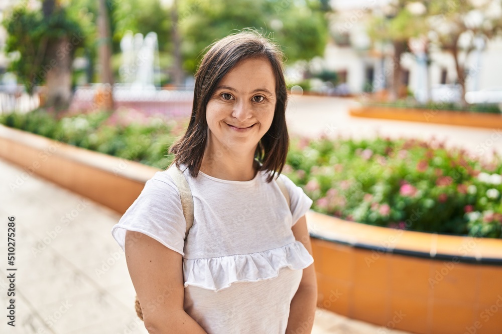 Naklejka premium Down syndrome woman smiling confident standing at park