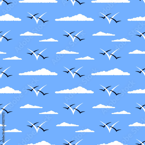 Clouds and gulls vector seamless pattern. Minimalist marine ornament in white and dark blue colors on blue background. Best for textile, print, wrapping paper, package and home decoration.