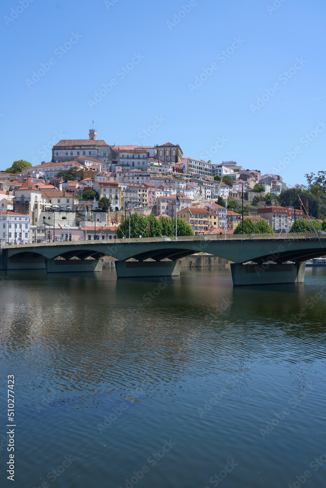 Naklejka premium Coimbra, Santa Clara bridge over Mondego river in Portugal - vertical