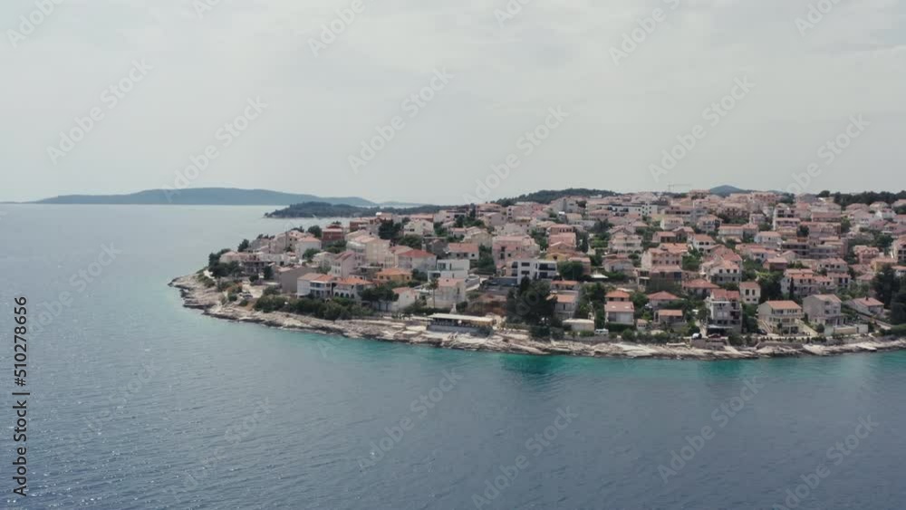 Aerial view of a city on an island in Croatia. Beautiful coastline with beaches in the city with a view of the Adriatic sea. Aerial view of a city on an island in Croatia. Beautiful coastline with beaches in the city with a view of the Adriatic sea.