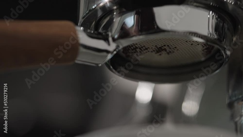Slow motion espresso extraction with naked portafilter photo