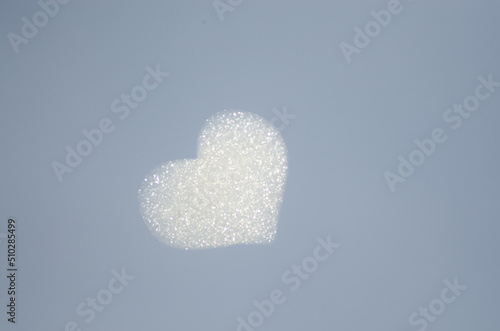 white heart shaped cloud on the blue sky