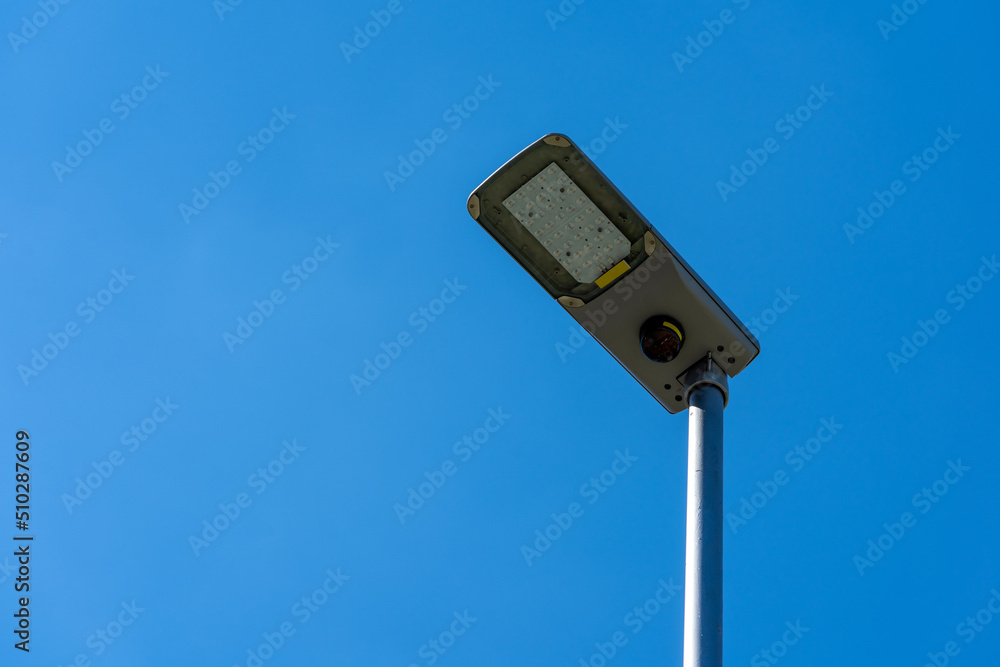 LED street lamps with energy-saving technology, no clouds on sky background, copy space LED street lamps with energy-saving technology, no clouds on sky background, copy space