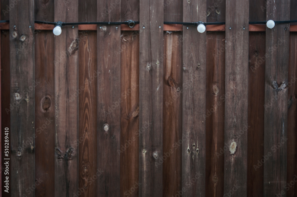 Fototapeta premium Old plank wooden wall background. The texture of old wood. Weathered piece of wood.