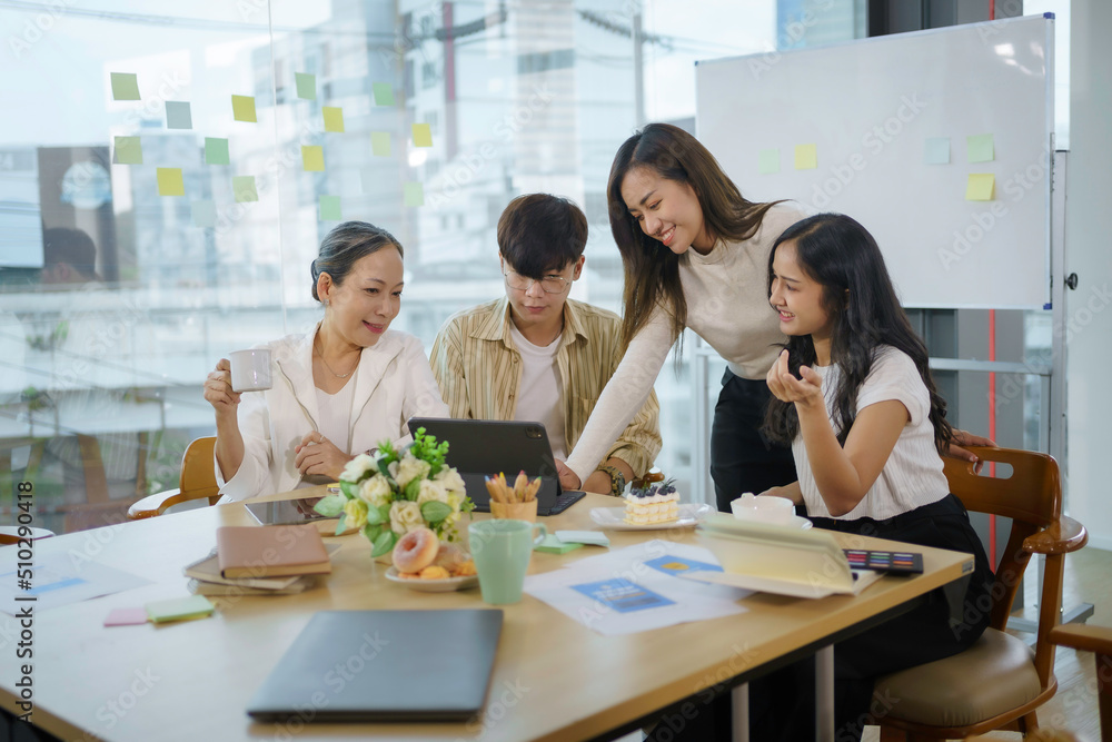 Meeting of Asian business people who are committed to work. Creative business team sitting working together at office. Meeting of Asian business people who are committed to work. Creative business team sitting working together at office.