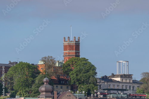 Old brick water tower in the district Södermalm at sunrise a sunny day in Stockholm