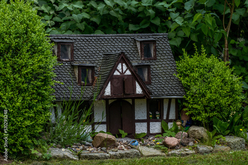 small miniature doll house in the woods