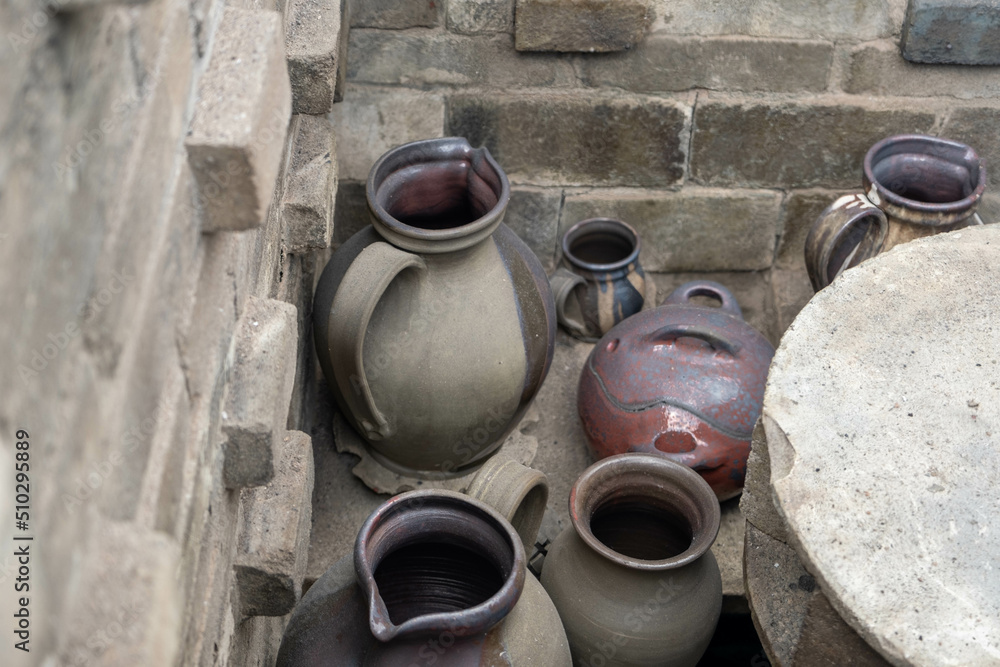 opening of a ceramic kiln, Unique handmade pots and dishes of clay getting black after firing and oxygen reducing process in wood fire kiln. Latvian national crafts opening of a ceramic kiln, Unique handmade pots and dishes of clay getting black after firing and oxygen reducing process in wood fire kiln. Latvian national crafts