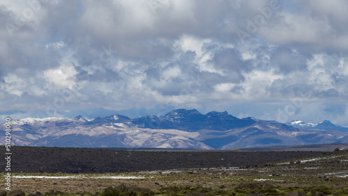 Clouds and huge mountains in Landscape of Apurimac Pampas Galeras, flatlands - Peru