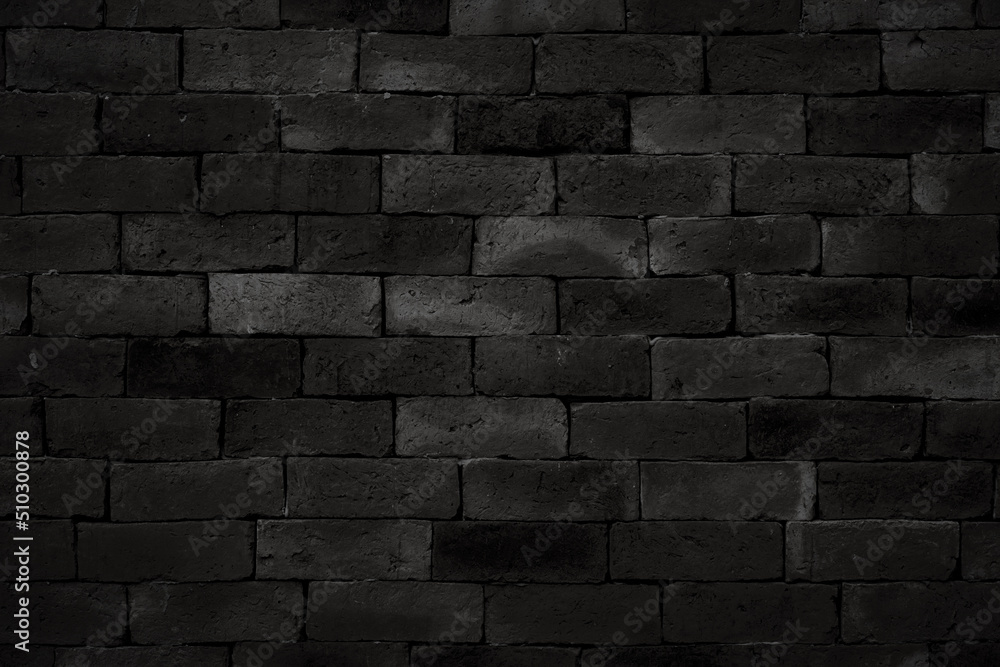 black brick wall background, dark stone texture.