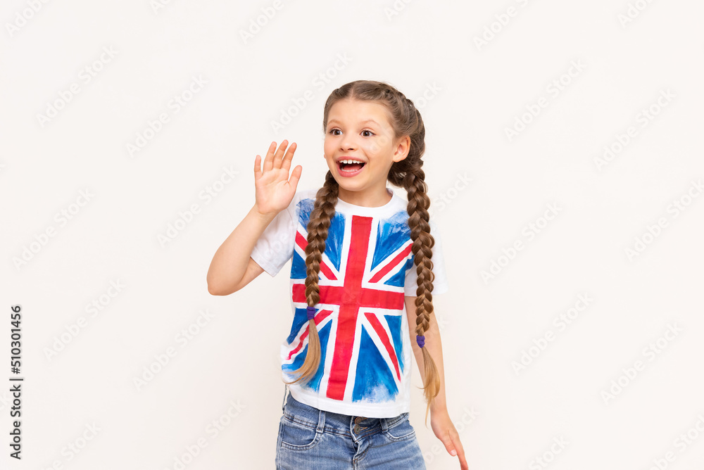 A child points to an advertisement for English language courses for schoolchildren on a white isolated background. A child points to an advertisement for English language courses for schoolchildren on a white isolated background.