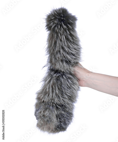 Fur fluffy cloth in hand on white background isolation