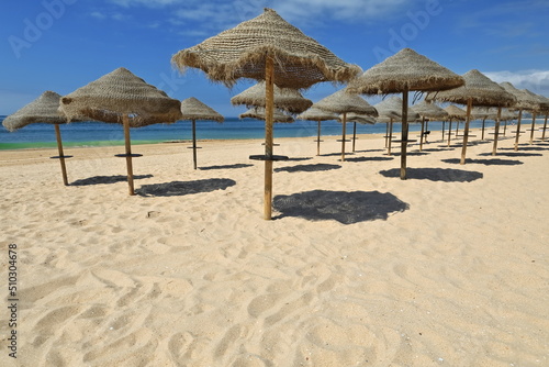 Sun umbrellas of plaited esparto fiber-Praia do Alvor Beach. Portimao-Portugal-318 © rweisswald