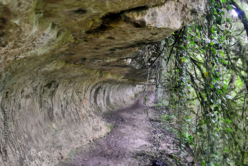 Natural passage in the rock to the Shakuransky waterfall, Abkhazia photo