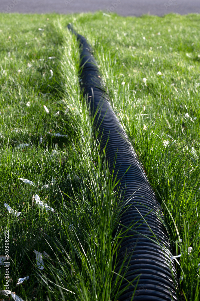 Corrugated water pipes. Pipes for use in outdoor Sewerage systems. Black long pipes Stock Photo