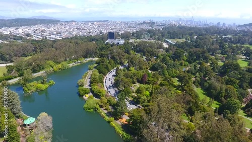 Aerial over San Francisco Golden Gate Park with downtown in distance photo